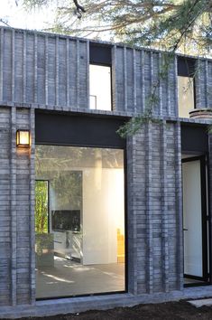 an exterior view of a house made out of concrete blocks