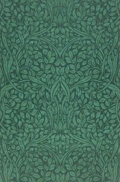 a green and black pattern with leaves on it