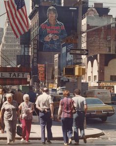 an old photo of people walking down the street in times square, new york city