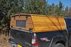 a truck with a wooden bed in the back