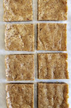 six squares of food sitting on top of a piece of paper