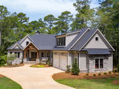 a large house in the middle of a wooded area