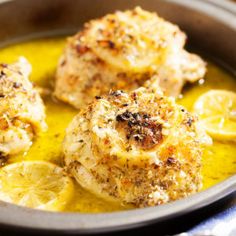 chicken with lemon sauce in a pan on a table