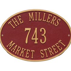 the miller's market street sign is shown in gold and red on a white background