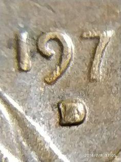 a close up view of the numbers on a coin