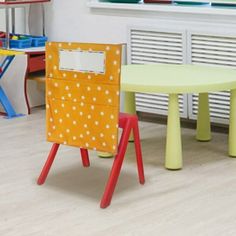 two children's tables and chairs in a playroom