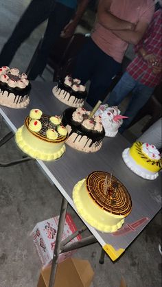 a table with several cakes sitting on it