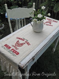 an old table with some flowers on it