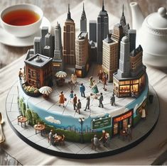 there is a cake that looks like a city with people and buildings on the top