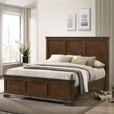 a bedroom with a bed, dresser and rug on the floor in front of a window