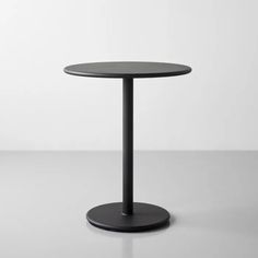 a black round table on a white background