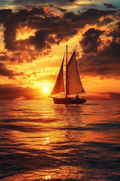 a sailboat is sailing in the ocean at sunset with clouds and sun behind it