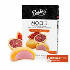 a box of mochi with blood oranges on the front and back side, sitting next to it's packaging