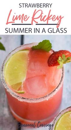 the strawberry lime rickey summer in a glass is garnished with strawberries and lime