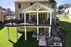 an aerial view of a house with stairs leading up to the front door and second story