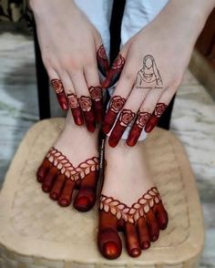 a woman's feet with hennap and tattoos on them