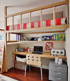 a bedroom with bunk beds, desk and shelves in it's corner area next to a bed