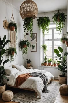 a bedroom with plants hanging from the ceiling and a bed in front of a window