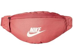 a pink nike fanny bag with white nike logo on the front and back side pocket