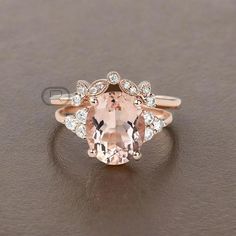 an oval shaped morganite and diamond ring