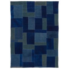 a blue and grey rug with squares on the bottom, in different sizes and colors