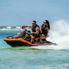 two people on a jet ski in the ocean