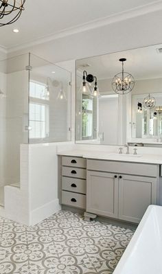 a large bathroom with two sinks and a bathtub next to a walk in shower