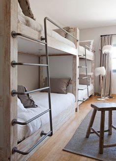 a bedroom with bunk beds and wooden floors