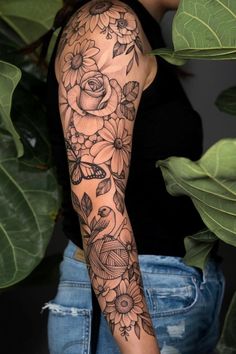 a woman with a flower tattoo on her arm