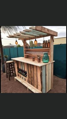 an outdoor bar made out of pallet wood