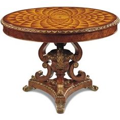 an ornately decorated table with intricate carvings on the top and bottom, is shown