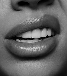 a woman's lips with white teeth