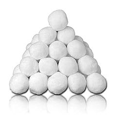 white cotton candy balls stacked up in the shape of a pyramid on a reflective surface