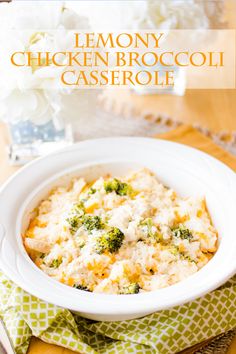 a white bowl filled with broccoli casserole on top of a table