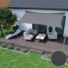 an outdoor living area with white furniture and grey awning