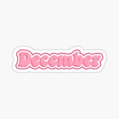 a pink sticker that says december with the word december written in large letters on it