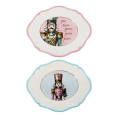 two porcelain plates with an image of a nutcracker and a soldier on them