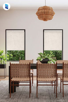 A modern dining room with beige blackout shades from Blinds.com.