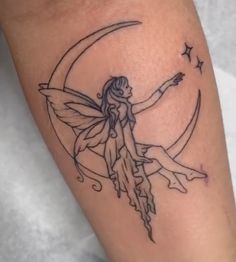 a fairy sitting on the moon with her hand out and pointing to the stars in the sky