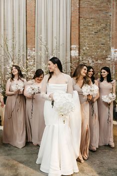 the bride and her bridesmaids are all dressed in different styles of gowns