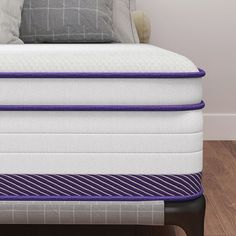 an image of a mattress with purple lines on it in the middle of a room