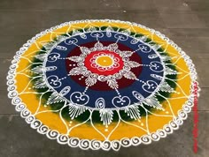 a colorful rangdi design on the ground