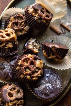 chocolate candies with nuts and walnuts are on a plate, ready to be eaten