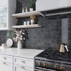 a kitchen with white cabinets and black tile backsplashing, gold accents on the shelves