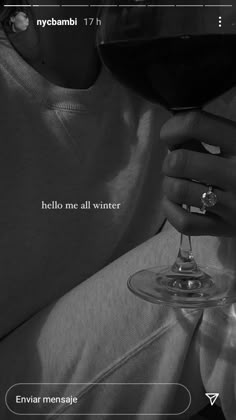 a woman holding a wine glass with the words hello me all winter written on it