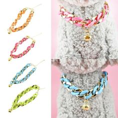 four different colored braided dog collars with bells and bell charms on each side