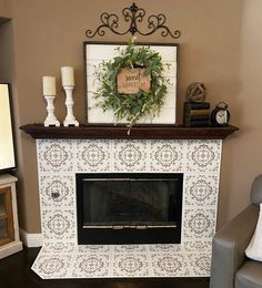 a living room with a fire place and chair in front of the fireplace decorated for christmas