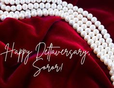 a white necklace with pearls on it and the words happy anniversary soar written in cursive writing