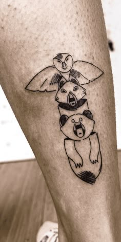 a tattoo on the leg of a person with a pokemon pikachu holding a baby