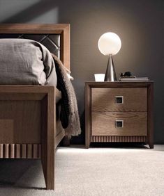 a bedroom scene with focus on the nightstands and the night stand next to the bed